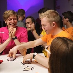 Team of developers playing games during the office event